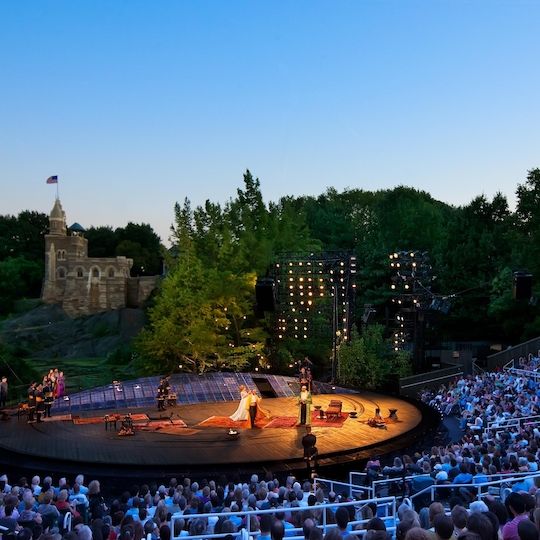 The Public Theater performs a play by William Shakespeare at the Delacorte Theater in Central Park