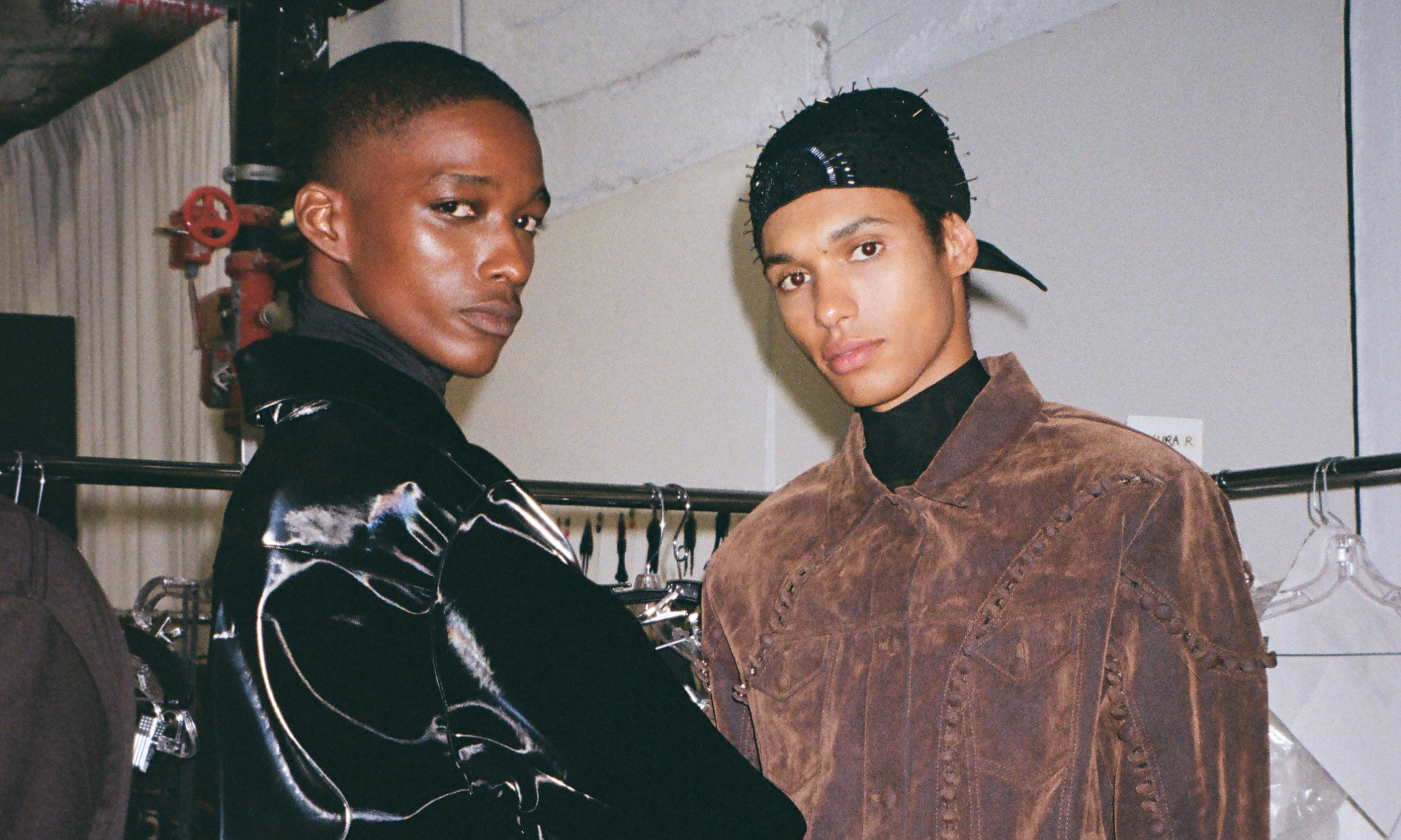 Two models posing backstage before LUAR's 2024 NYFW show at Rockefeller Center