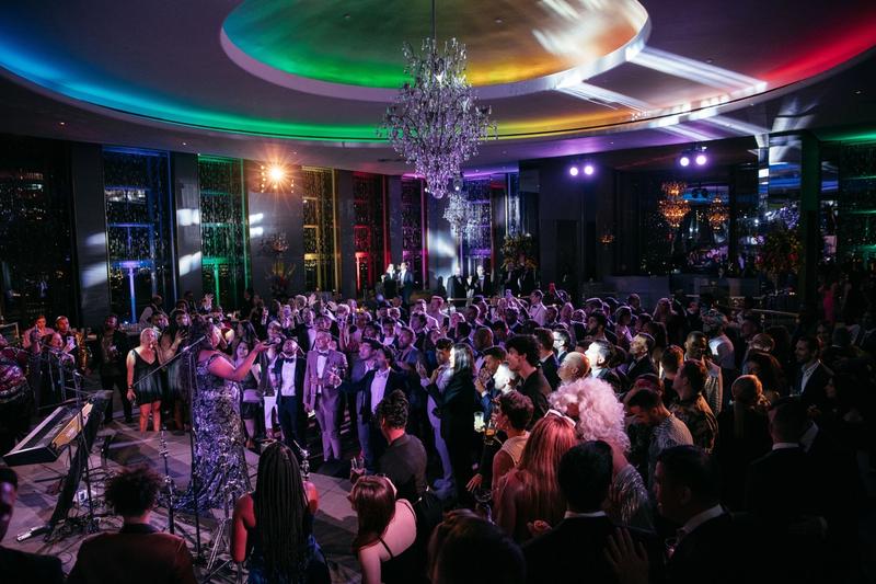 a group of people dancing at the rainbow room