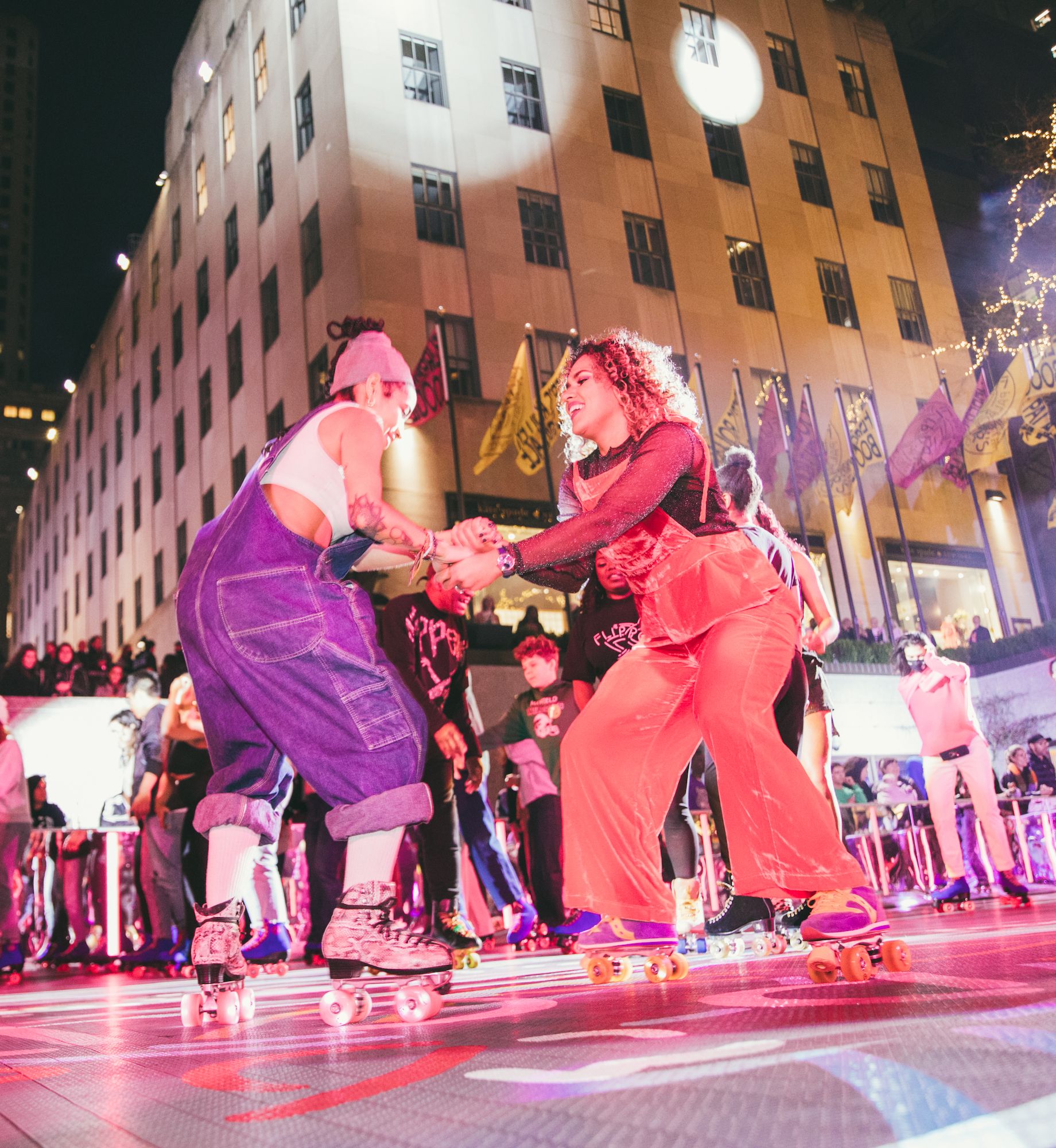 Two people skating at Flipper's Roller Boogie Palace at The Rink