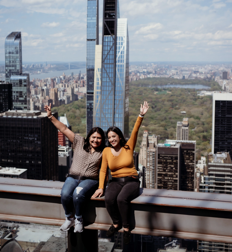 A mother and daughter on The Beam at Top of the Rock