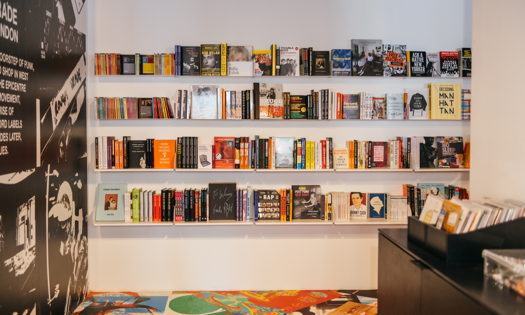 Books sitting on a wall display at Rough Trade Above