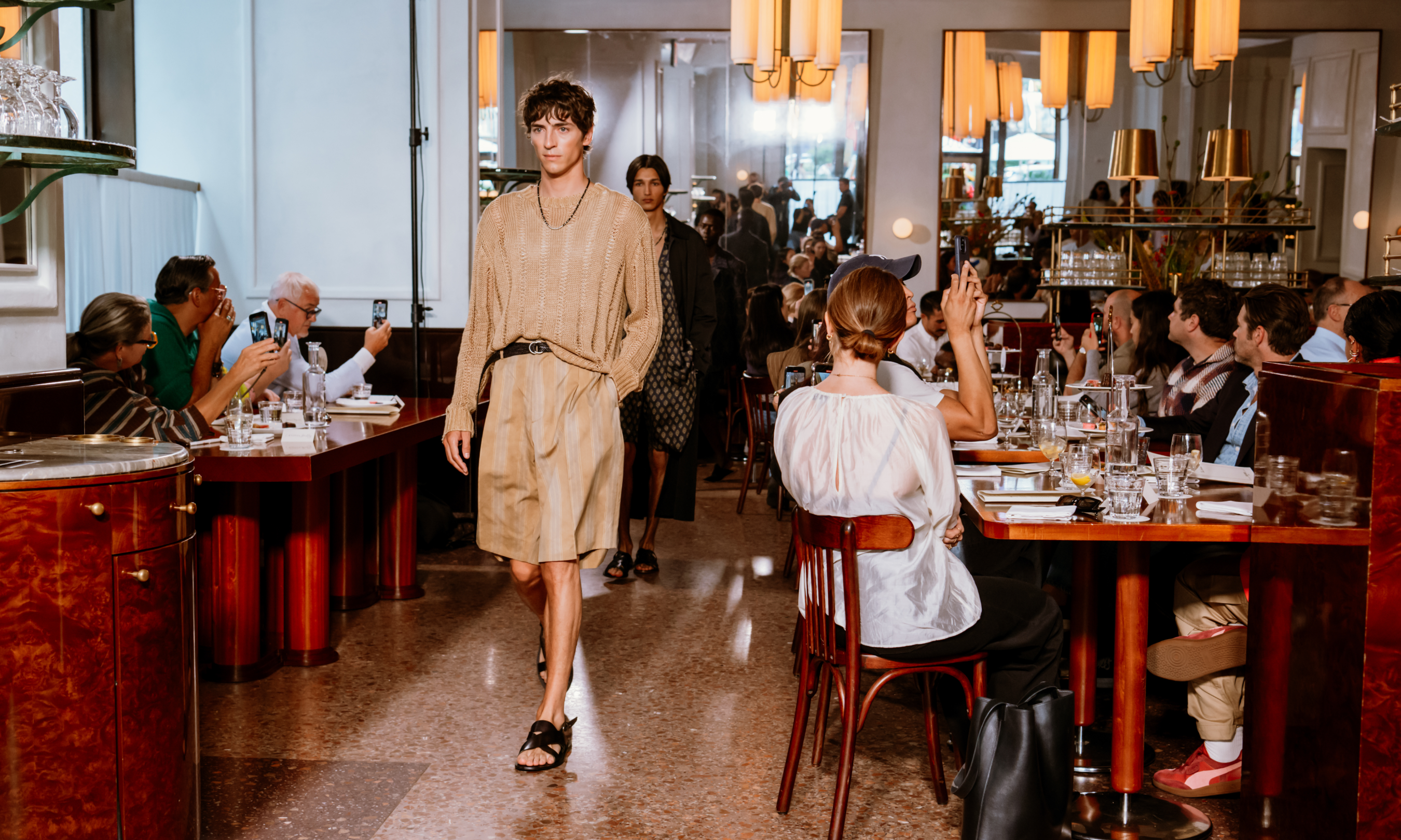 Model in a tan outfit walking in Todd Snyder's 2024 NYFW show at Le Rock