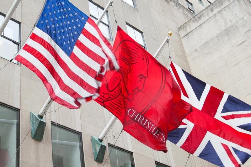 Christie's flag next to American and English flag 