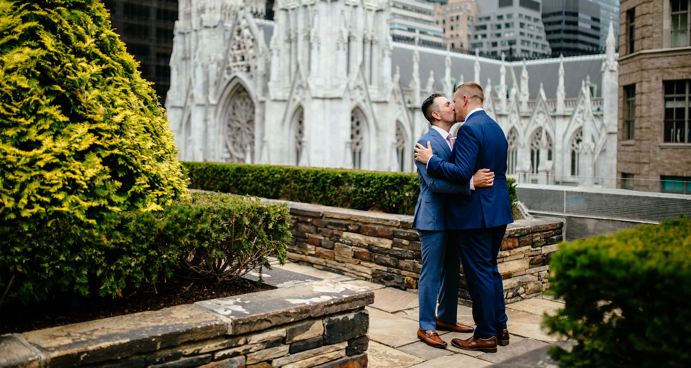 Christian and Robert sharing a kiss on their wedding day