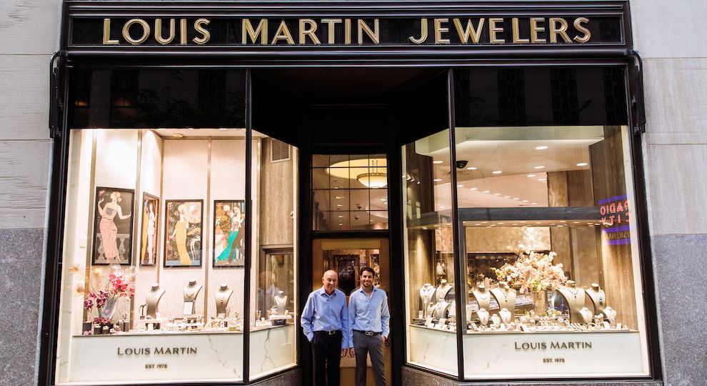 The owners of Louis Martin standing outside of their storefront