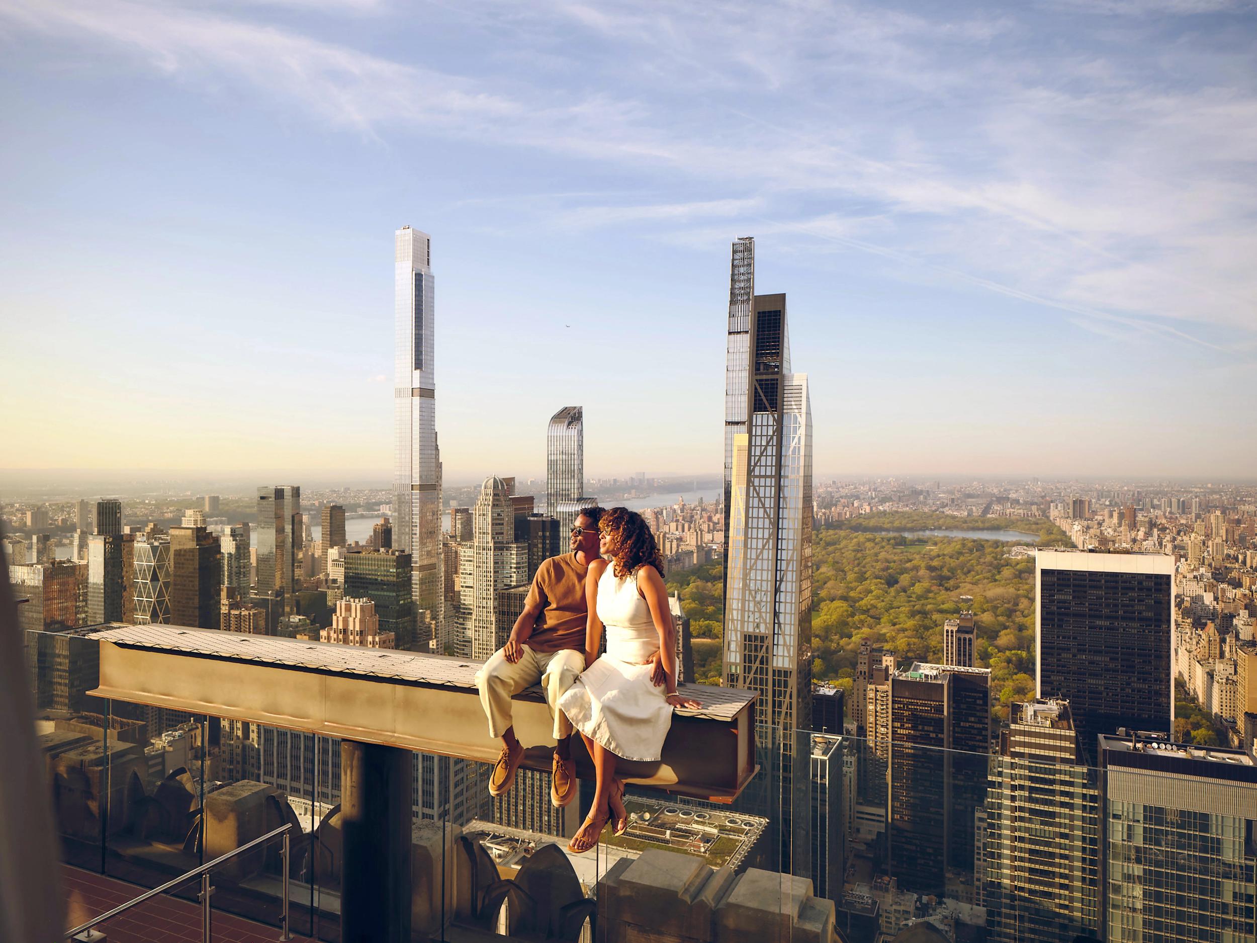 A couple on The Beam at Top of the Rock