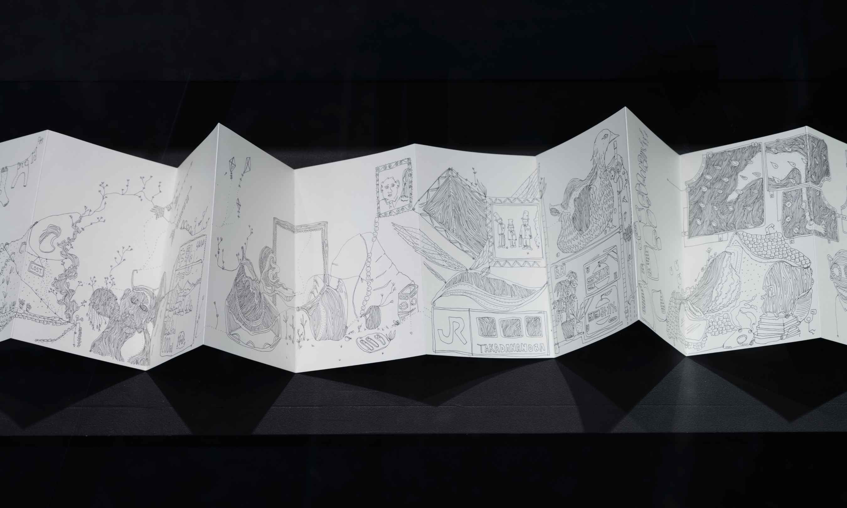 An accordion sketchbook designed by artist Shantell Martin