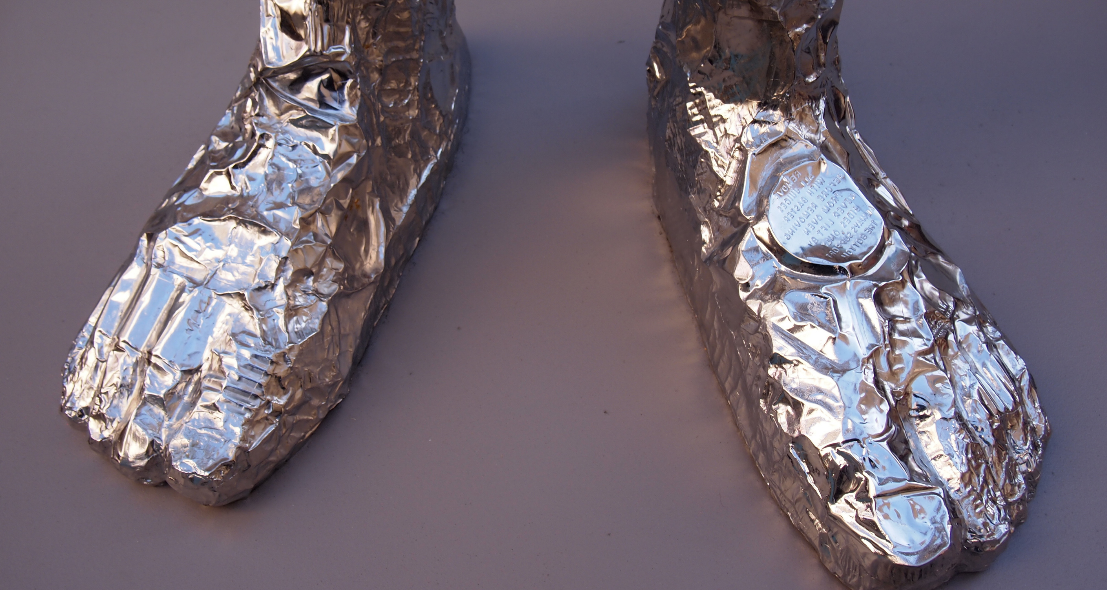 The feet of Tom Friedman’s “Looking Up” sculpture