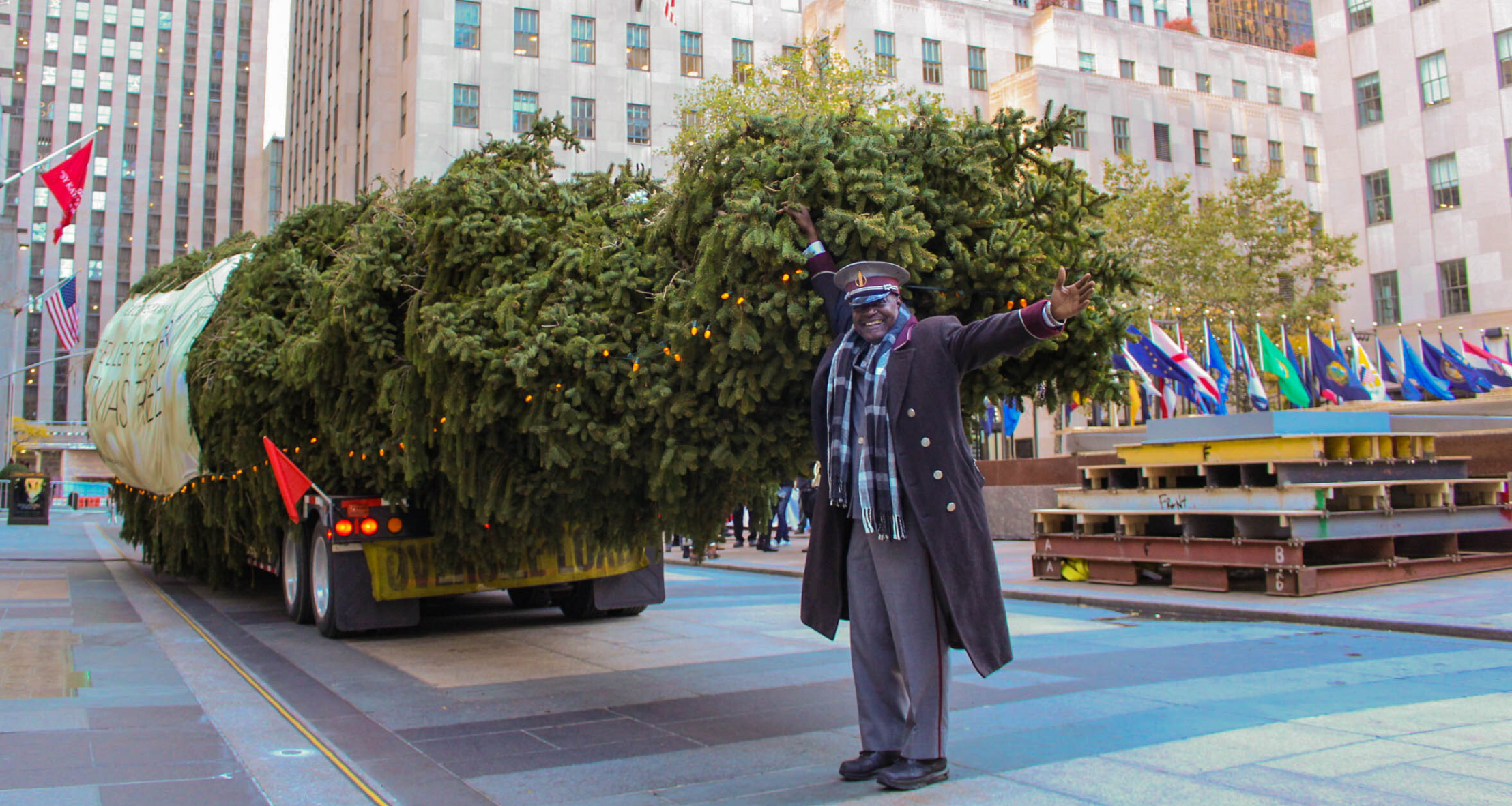 CJ in front of the Rockefeller Center Christmas Tree before it is raised on the plaza