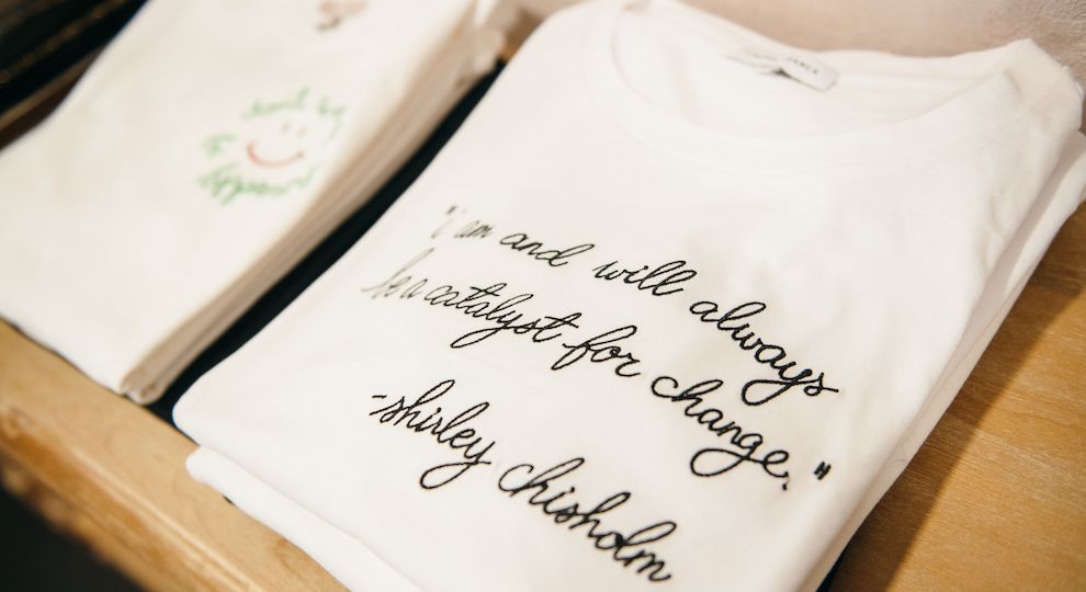 Quote from Shirley Chisholm embroidered on a cashmere sweater from Lingua Franca