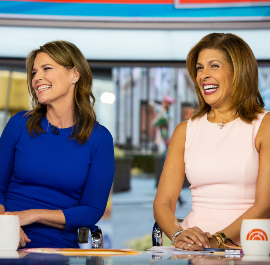 An image oh Hoda Kotb and Savannah Guthrie on set at the Today Show