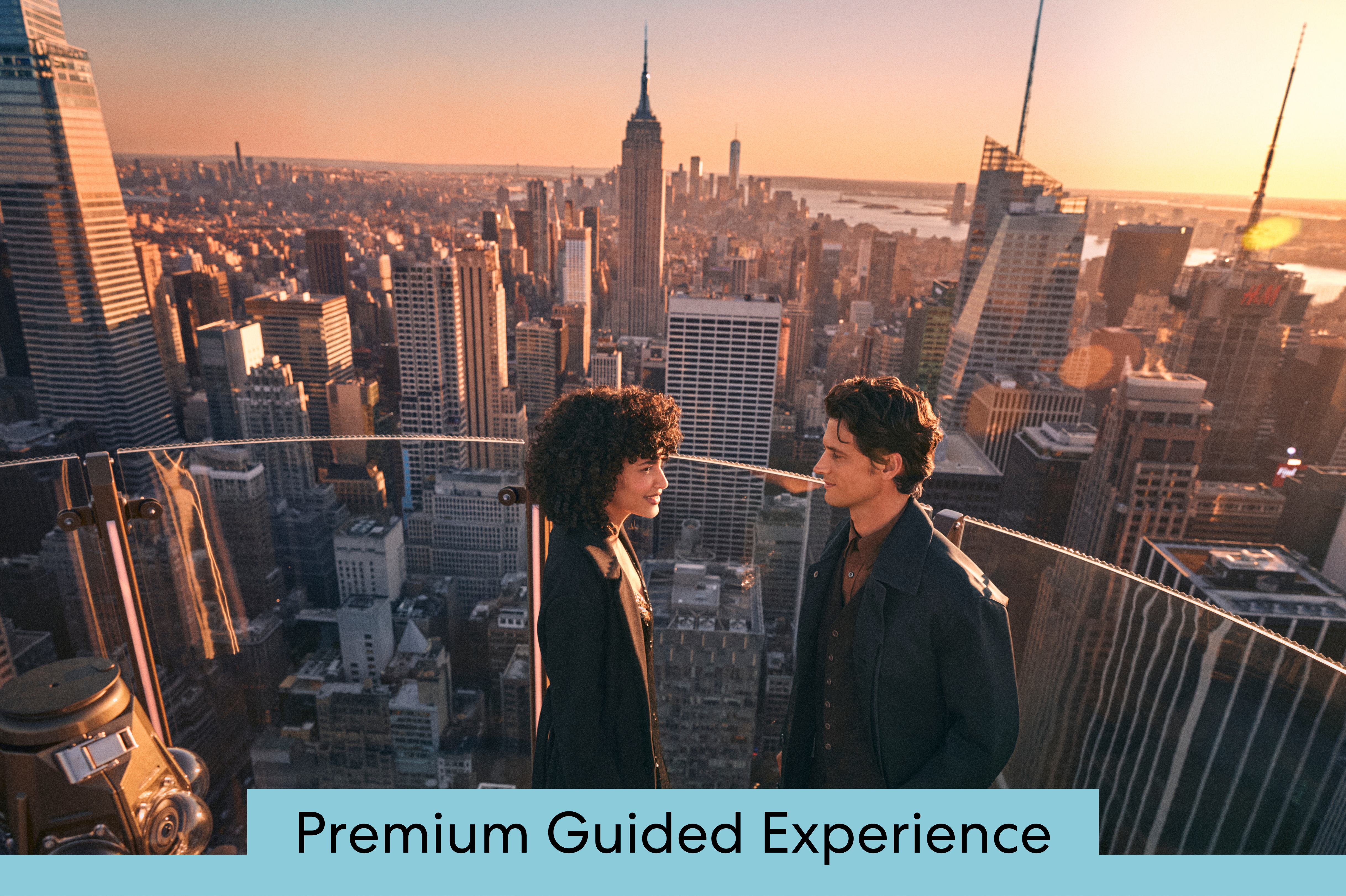 two people at sunset in front of the city