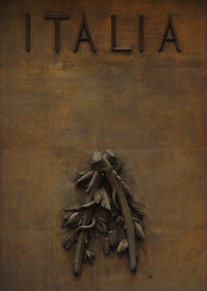Italia, a plaque by Giacomo Manzu on display above the entrance to 626 Fifth Avenue.