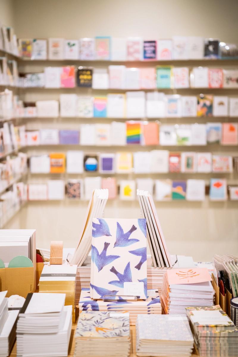 Notebooks and greeting cards on shelves