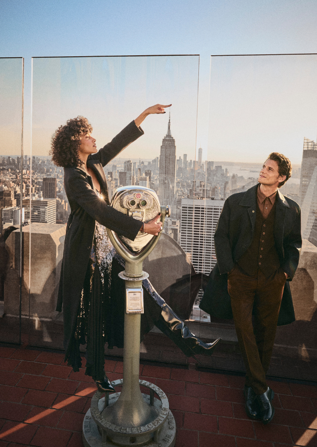 Man looks at the view at the Top of the Rock