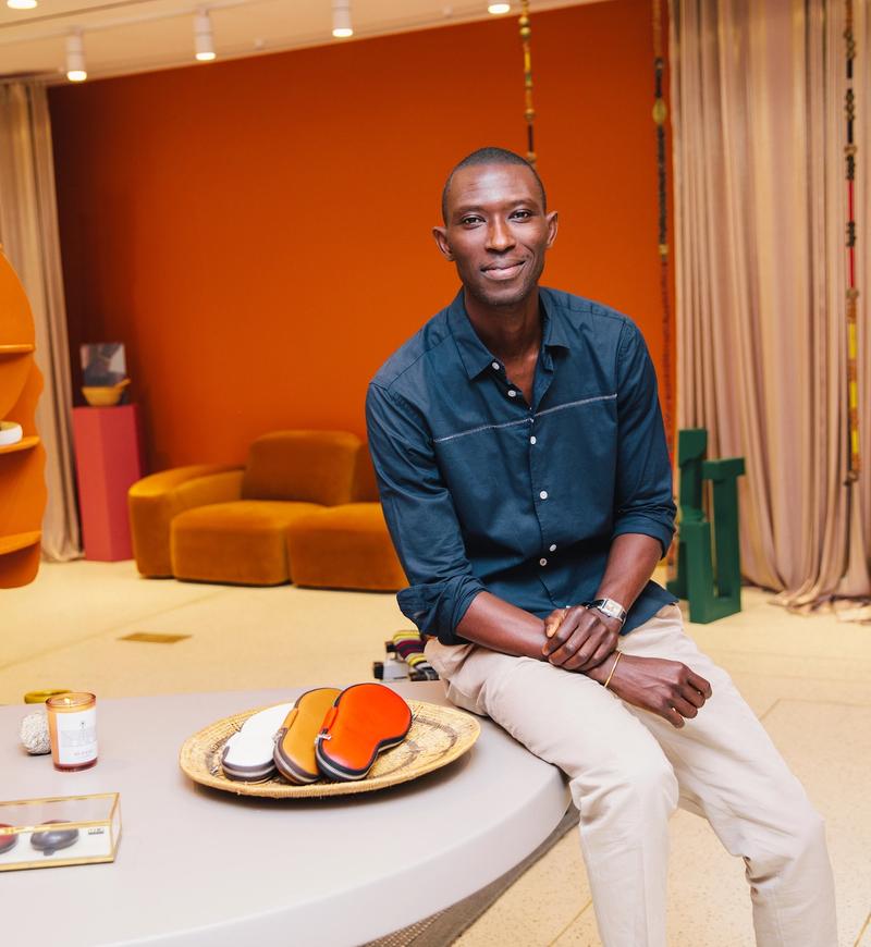 Model and designer Armando Cabral sits in his first brick-and-mortar store at Rockefeller Center