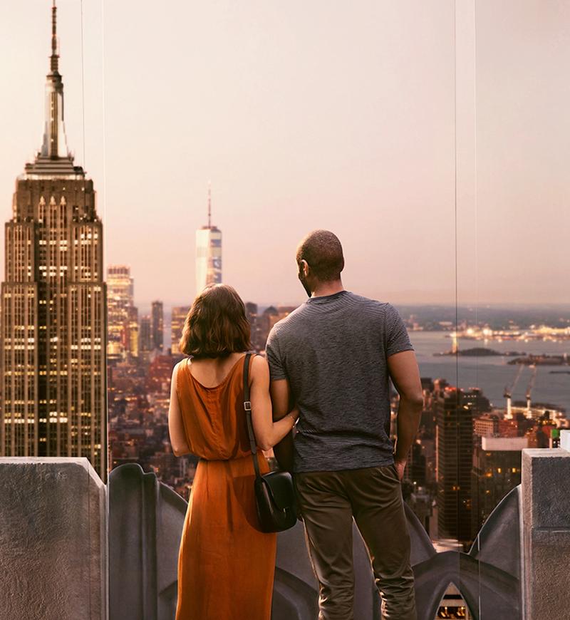 Couple looking at the view of New York City from Top of the Rock