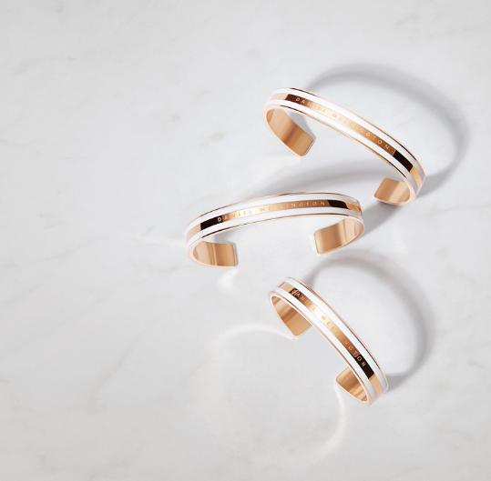 Three gold cuffs from Daniel Wellington