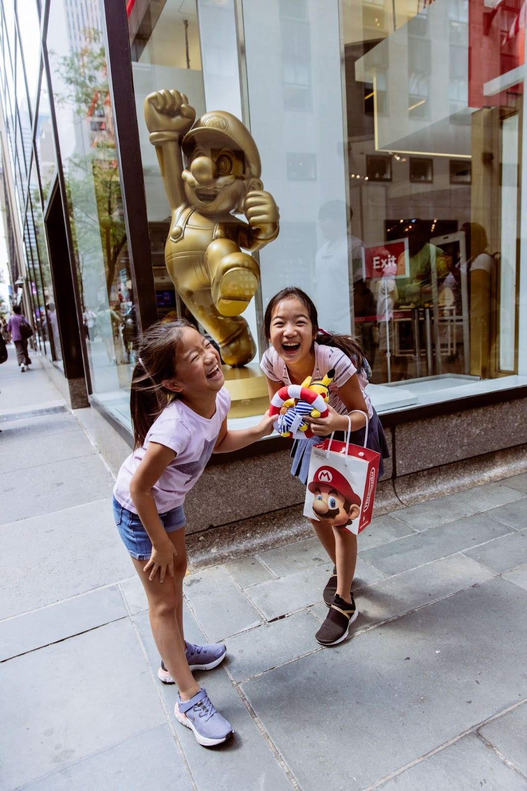 A family of four ice skating at The Rink at Rockefeller Center