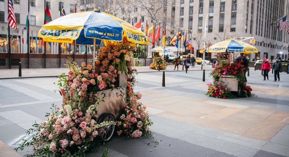 Hot Dog Cart Flower Flash by Lewis Miller in front of Rockefeller Center