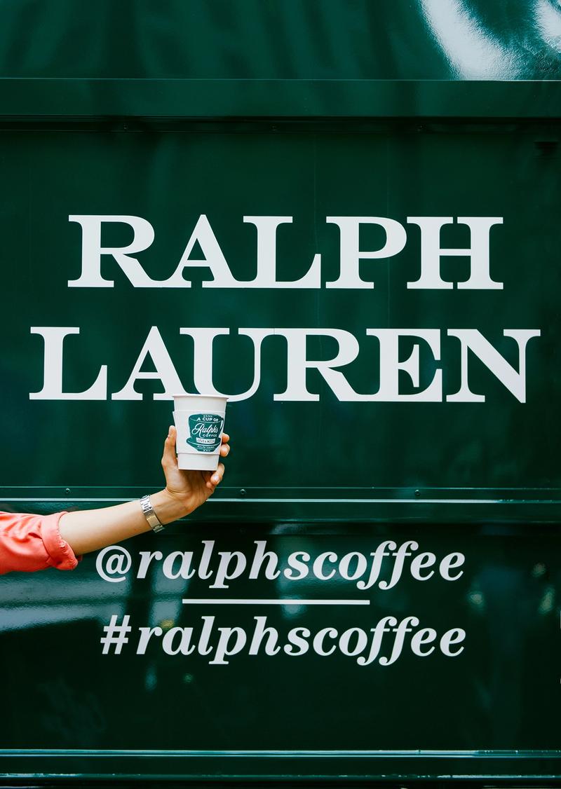 Coffee held in front of Ralph's Coffee Truck