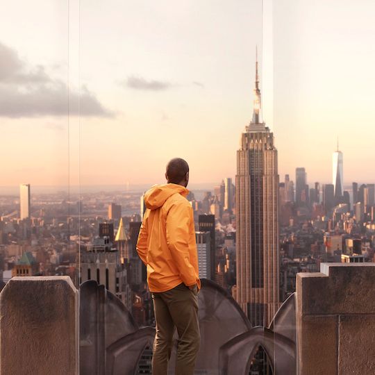 Man experiencing a sunset view at Top of the Rock
