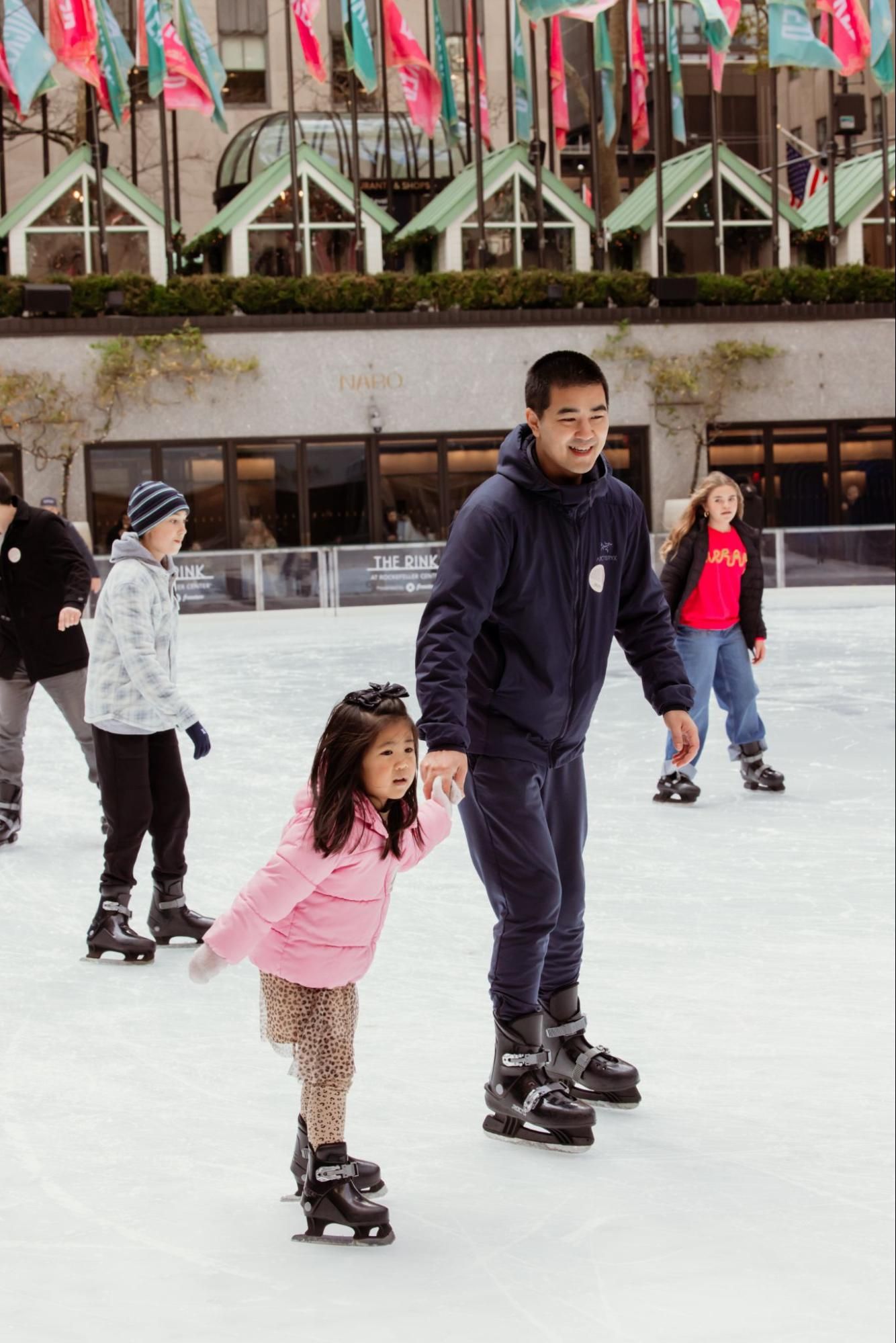 Kids ice skating at The Rink at Rockefeller Center