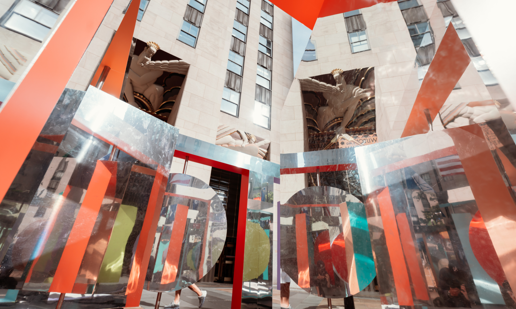 Wade and Leta's "Reflection Point" sculpture reflecting the surrounding buildings on Center Plaza