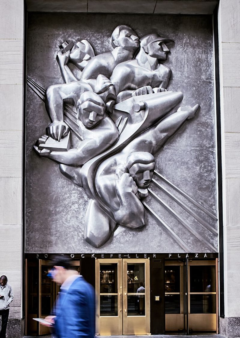 News, a plaque sculpture by Isamu Noguchi above the 50 Rockefeller Plaza main entrance.