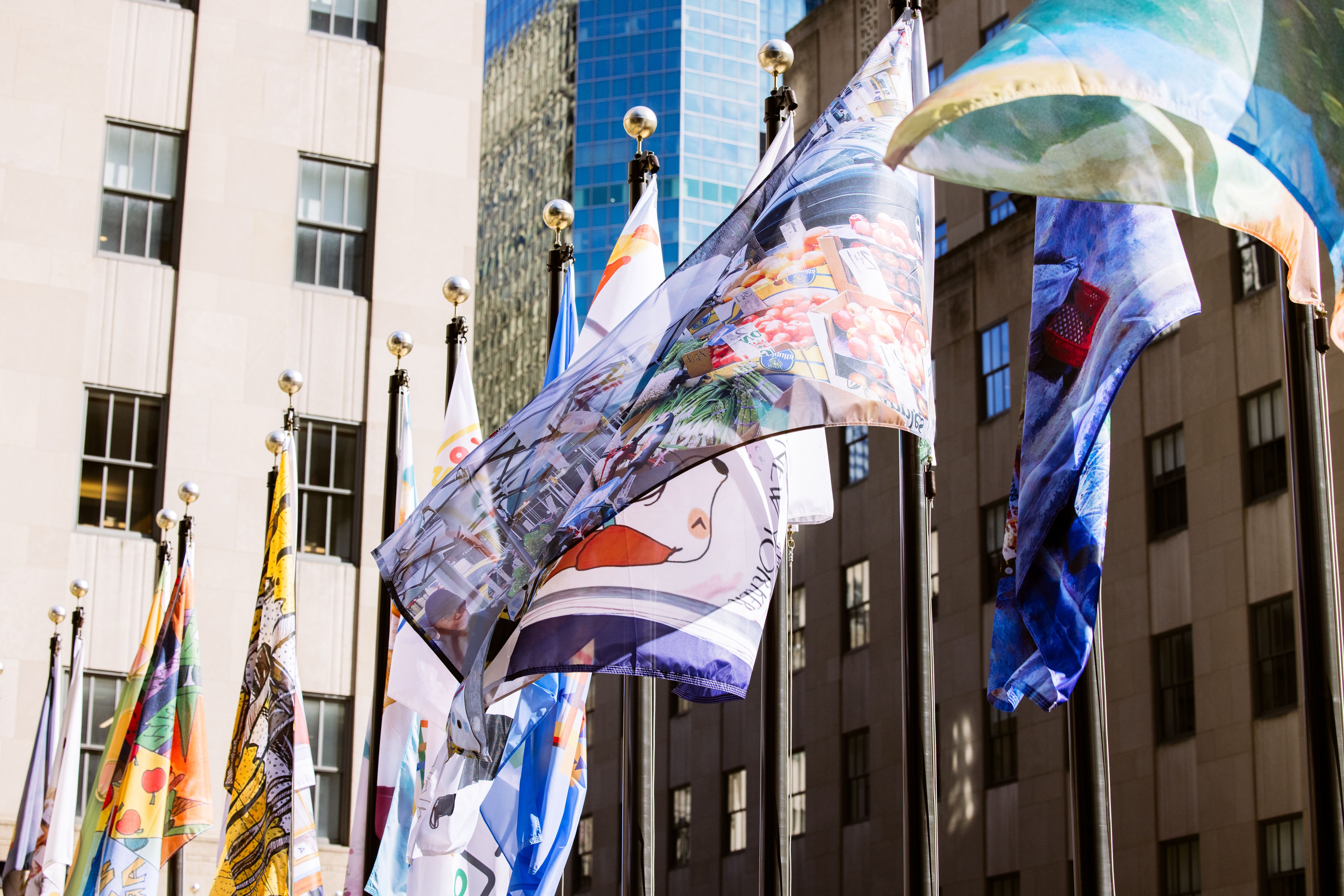 The Flag Project 2023 flags flying over The Rink at Rockefeller Center