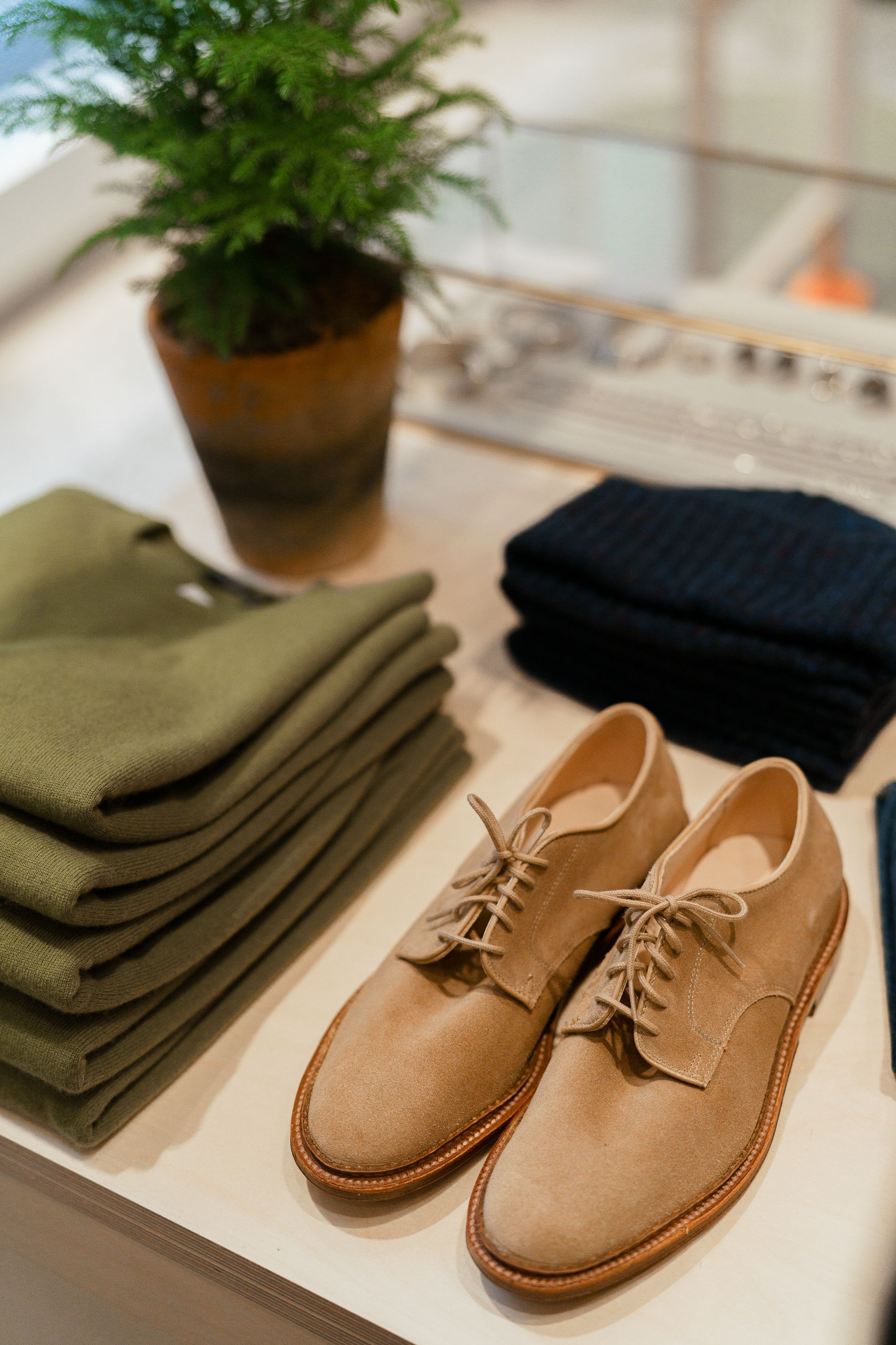 Tan shoes and a green sweater