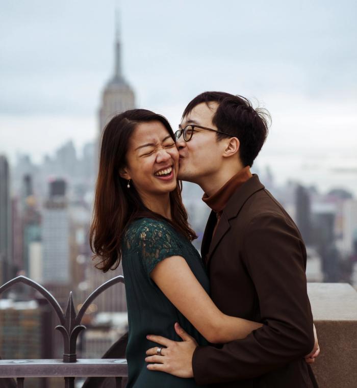Couple posing for a photo at Top of the Rock