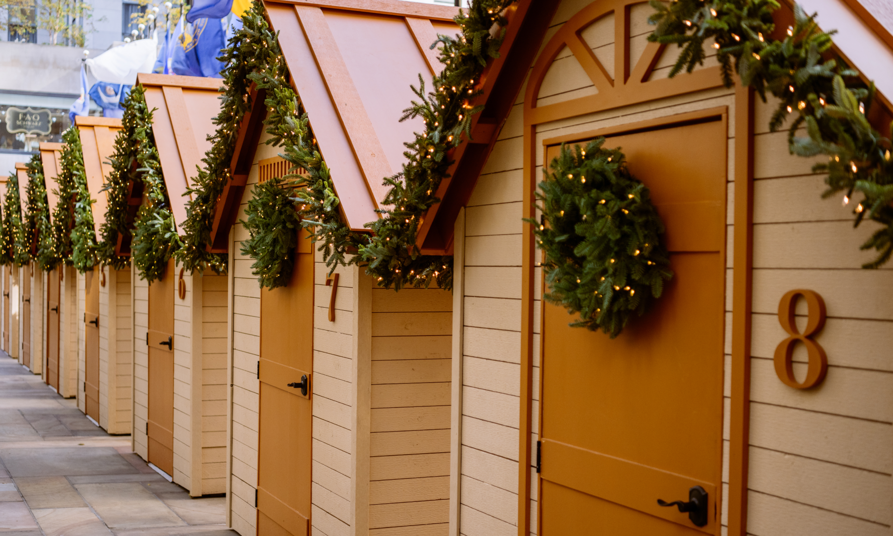 A row of Après Skate Chalets presented by Balsam Hill at Rockefeller Center