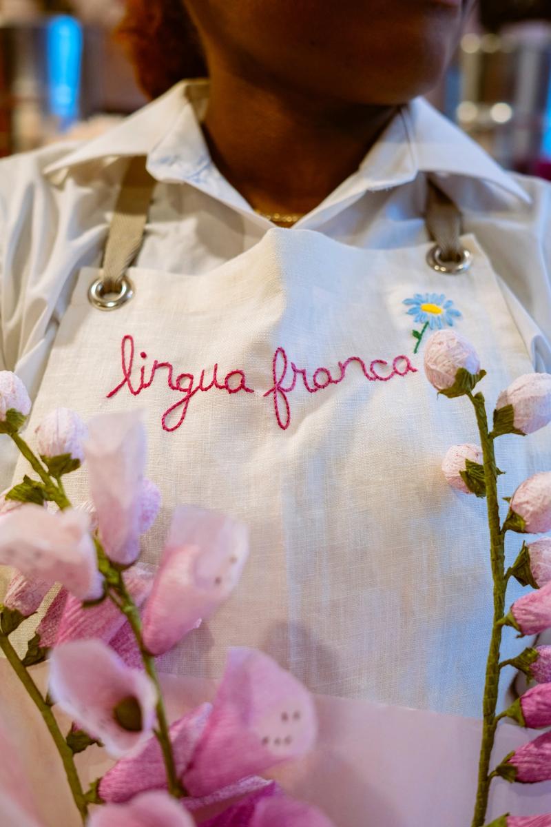 Lingua Franca employee and paper flowers