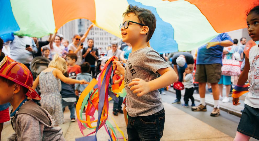 Kids and parents attending a live concert by Rock and Roll Playhouse