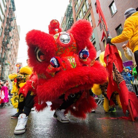 Person in a dragon costume at the Chinatown Lunar New Year Parade