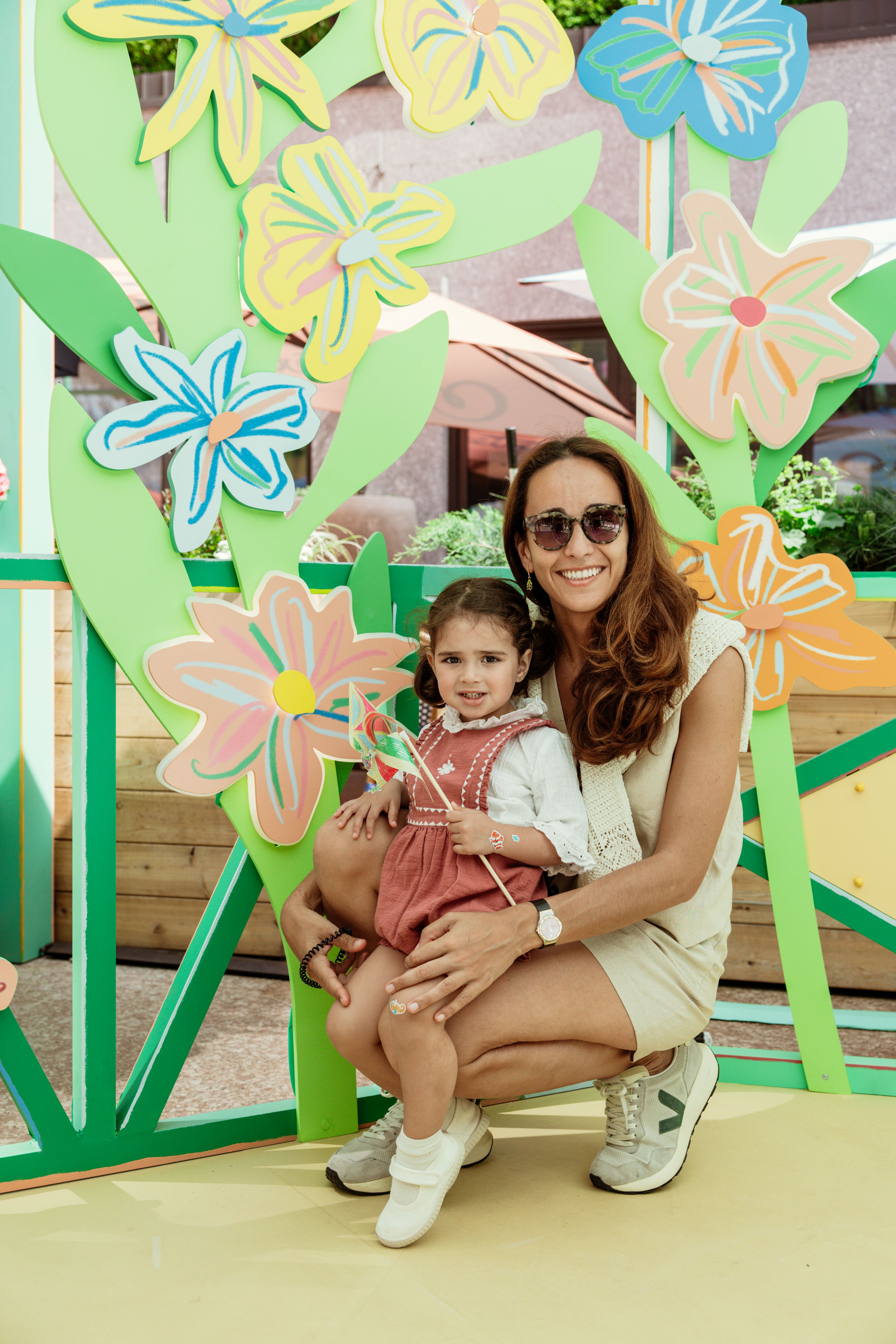 mother and daughter smiling at rockefeller center