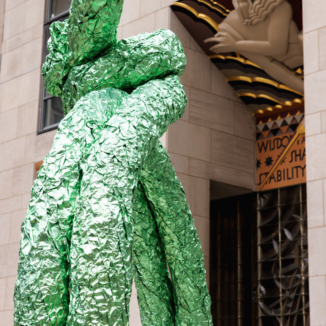 A close-up of artist John Chamberlain's green RITZFROLIC sculpture on Center Plaza at Rockefeller Center