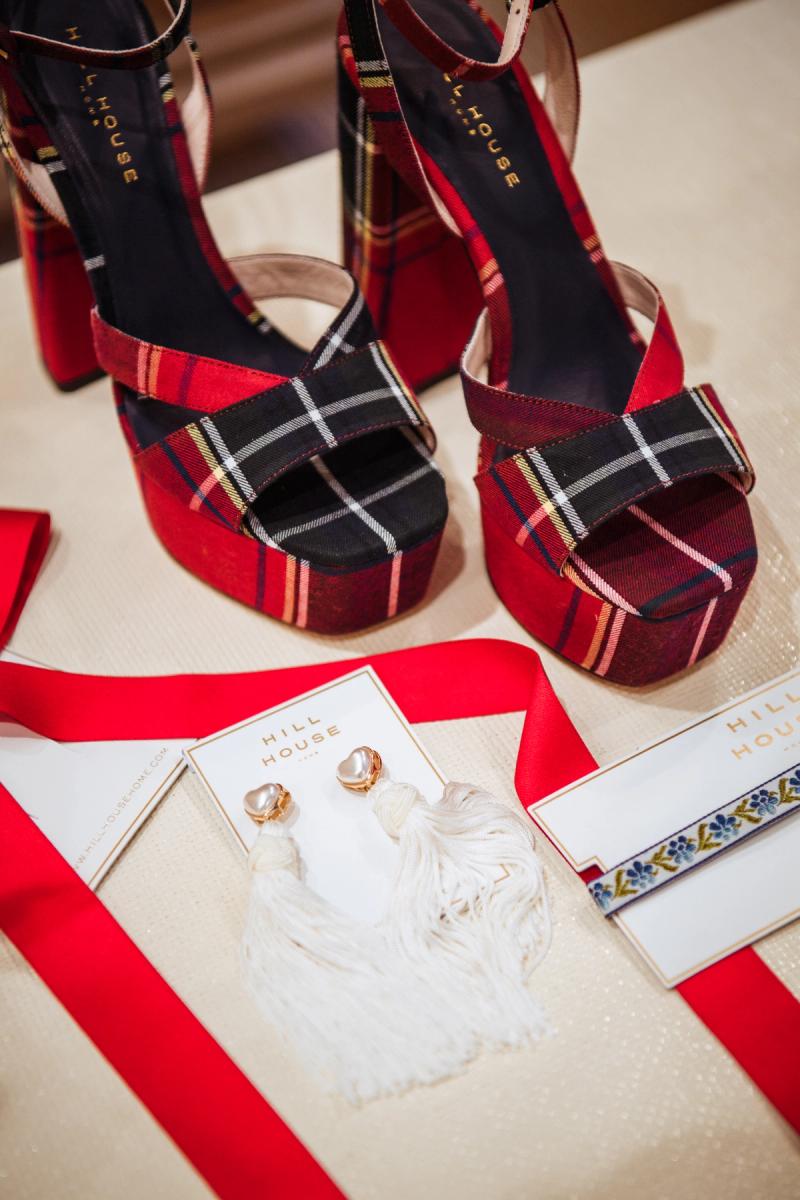 Hill House Home plaid heels and dangly earrings on a white table