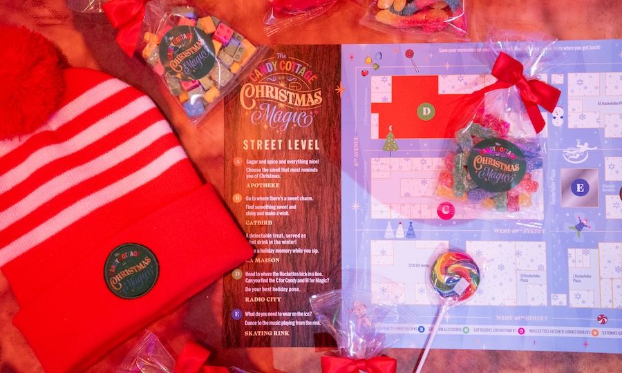 Bags of candy, a red hat, and a map of the The Candy Cottage of Christmas Magic scavenger hunt