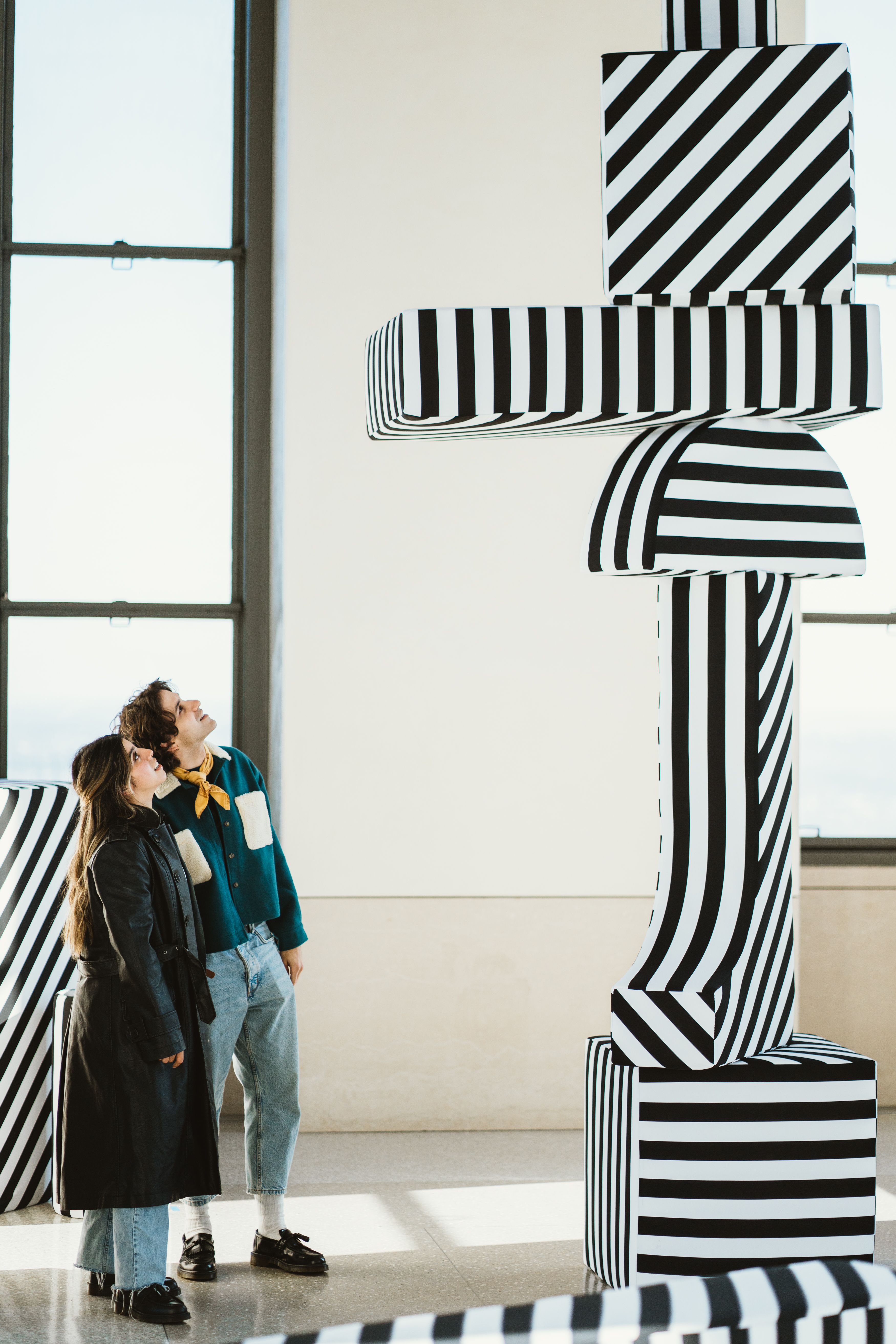 Photo of large black and white striped sculptures that make up the Buildings and Blocks installation at Top of the Rock.