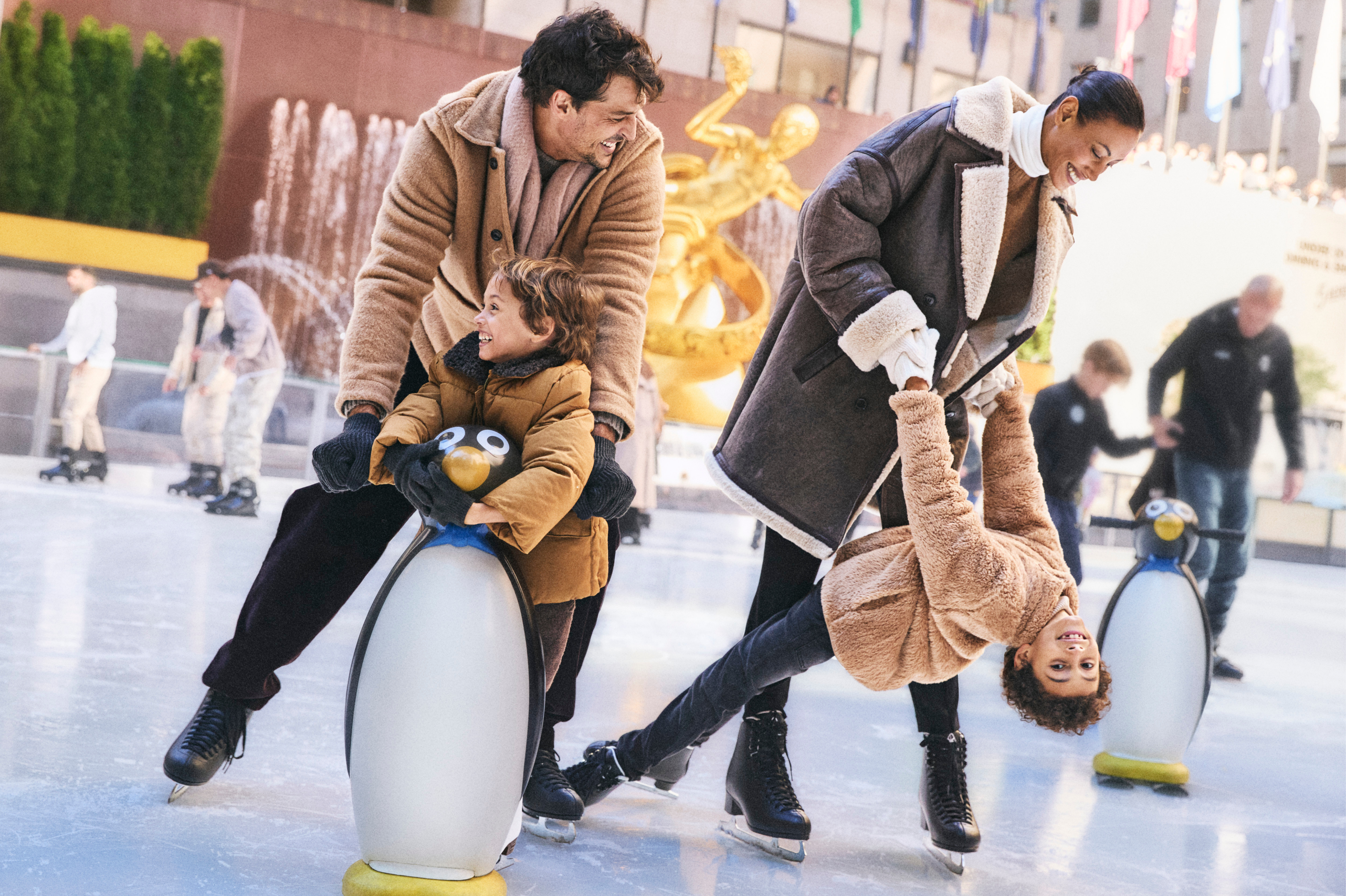 family skating on the rink together