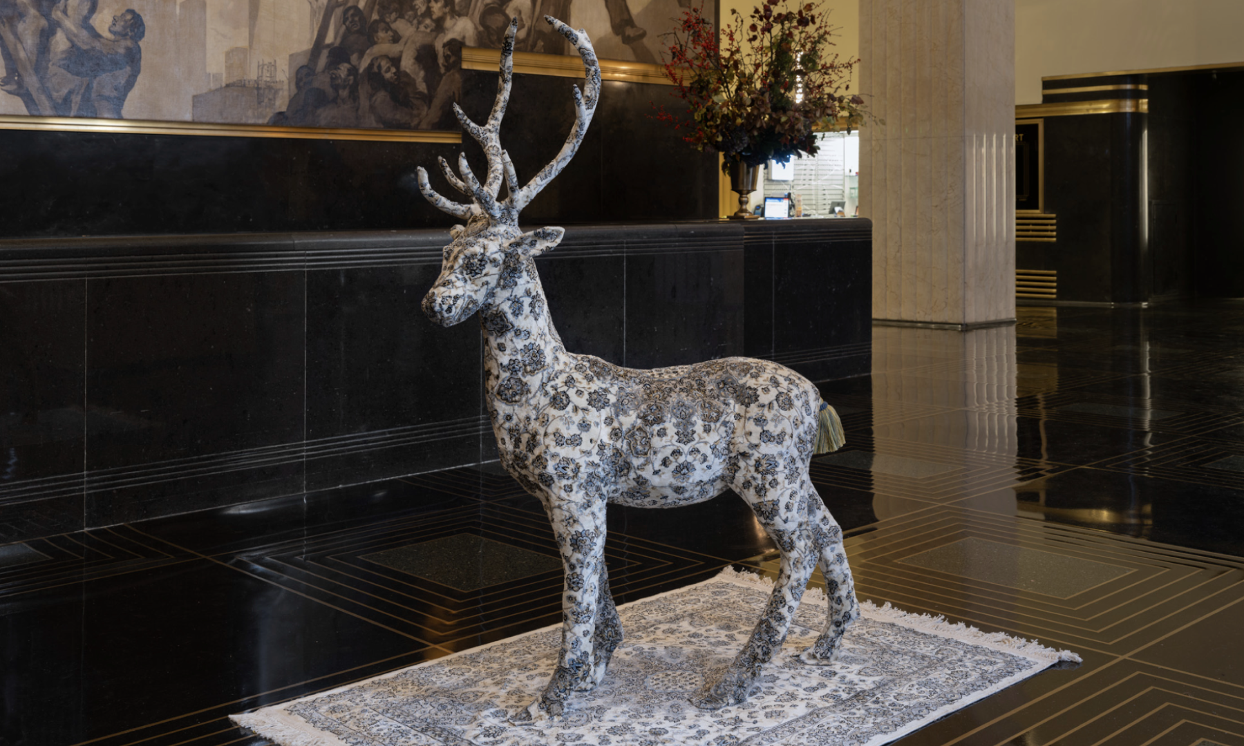 A deer sculpture overlayed with a tapestry by artist Debbie Lawson