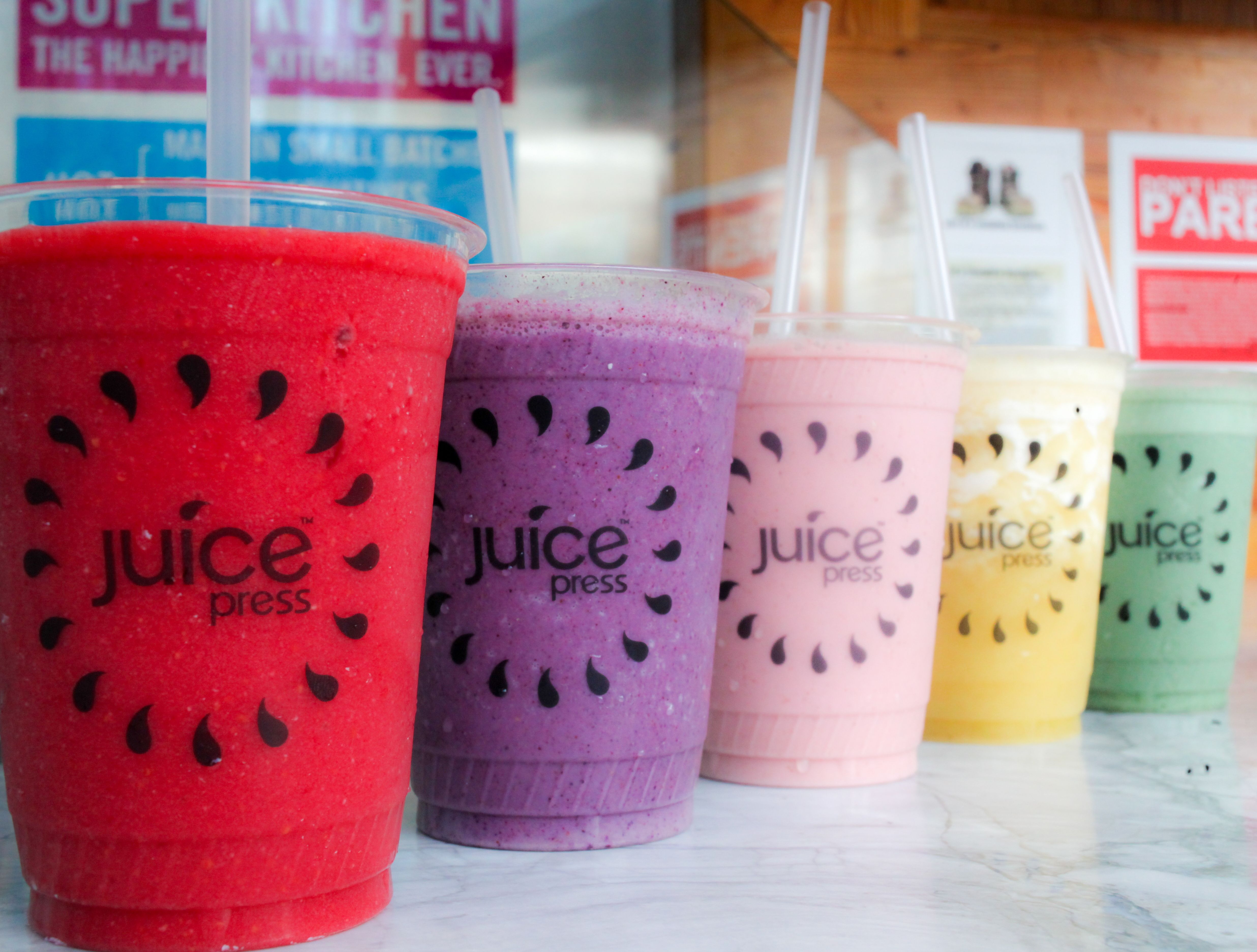 Juice Press colorful juices in plastic cups