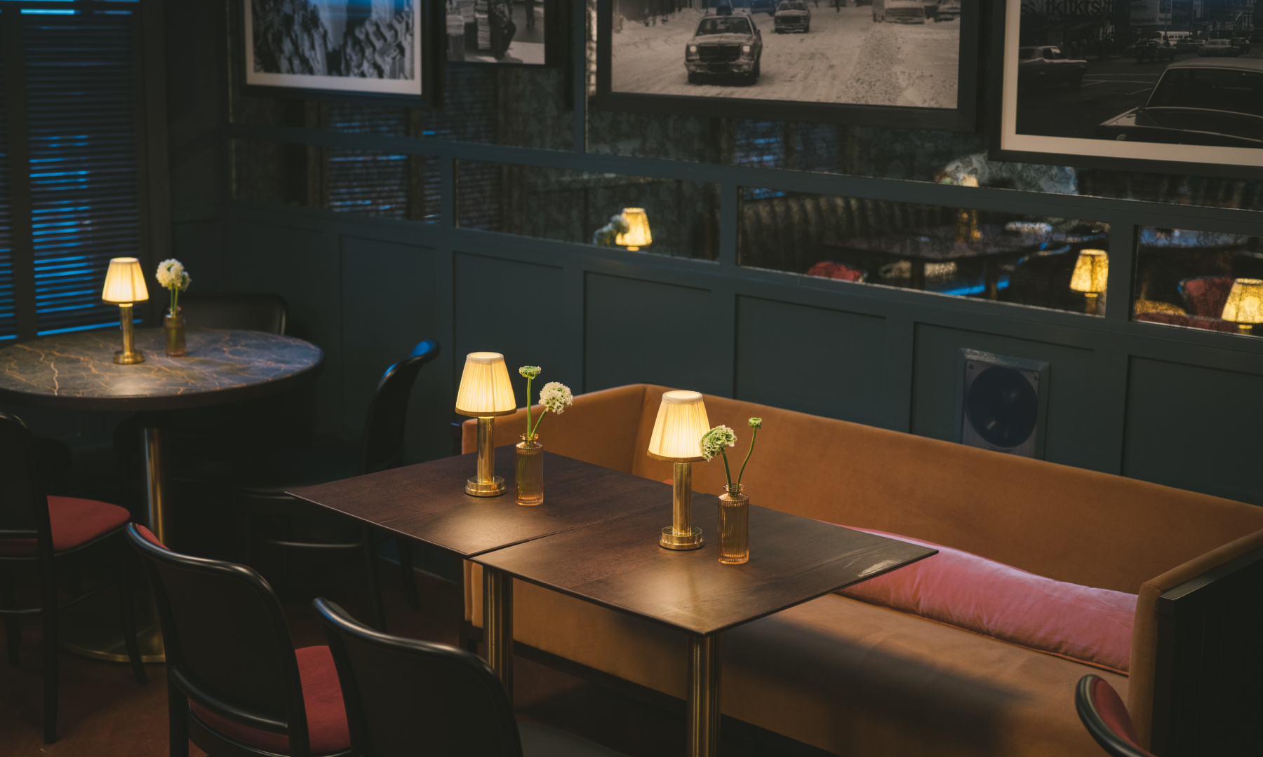 A table with couch seating at Pebble Bar at Rockefeller Center