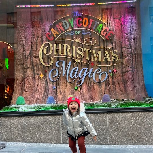 Child at The Candy Cottage of Christmas Magic