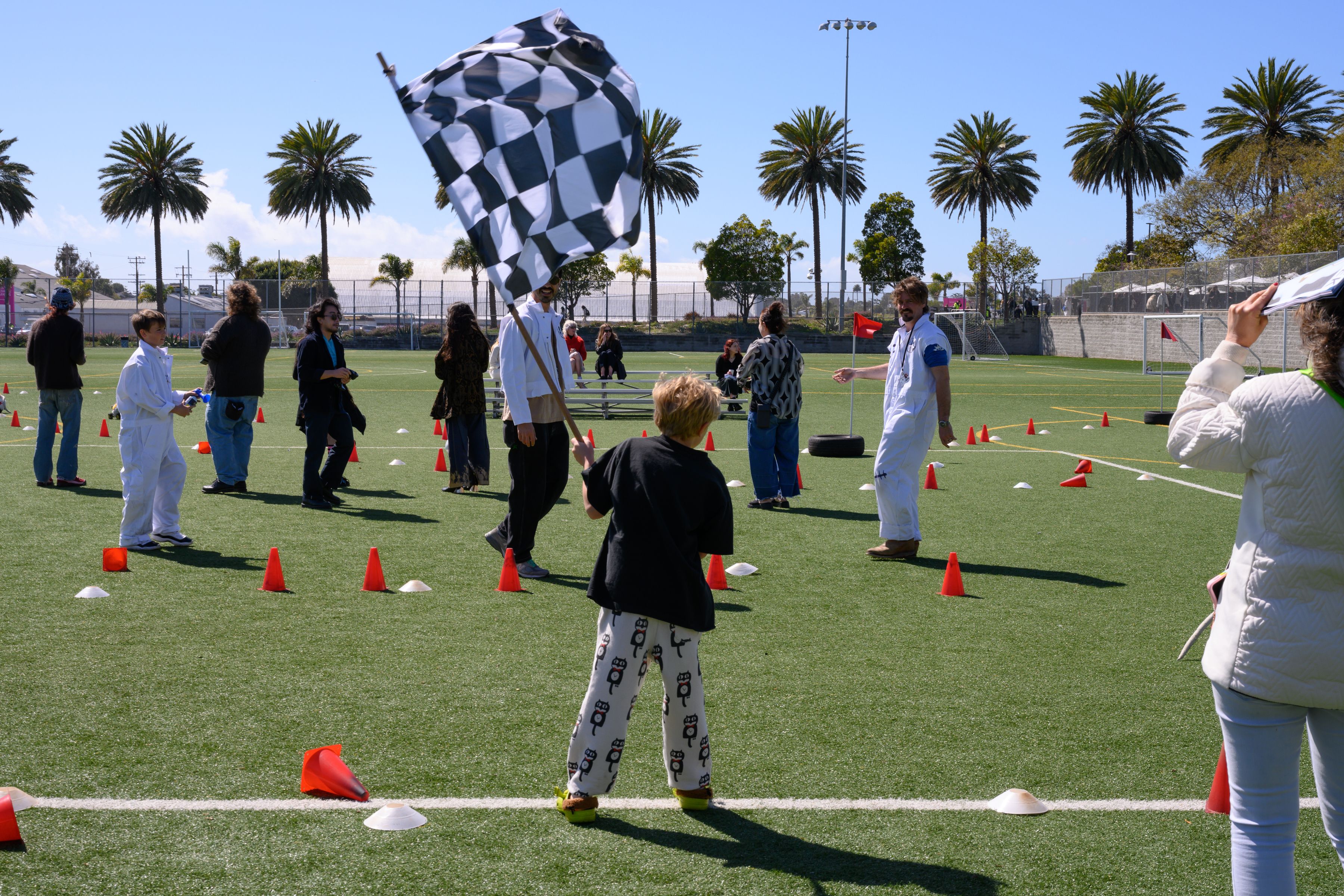 Kid waving a checkered flag