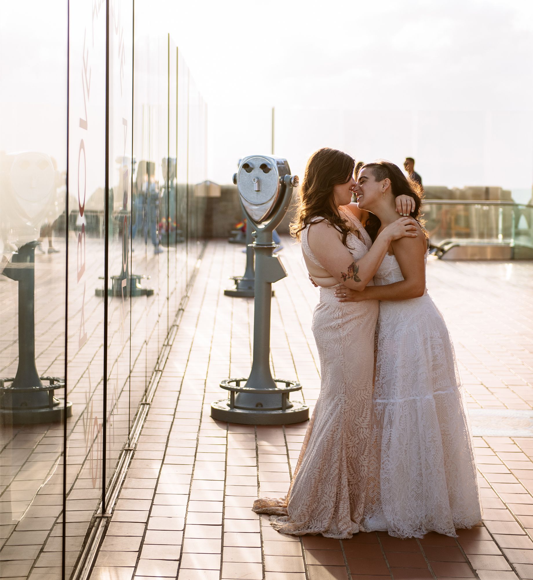 A couple poses for a wedding picture at Top of the Rock