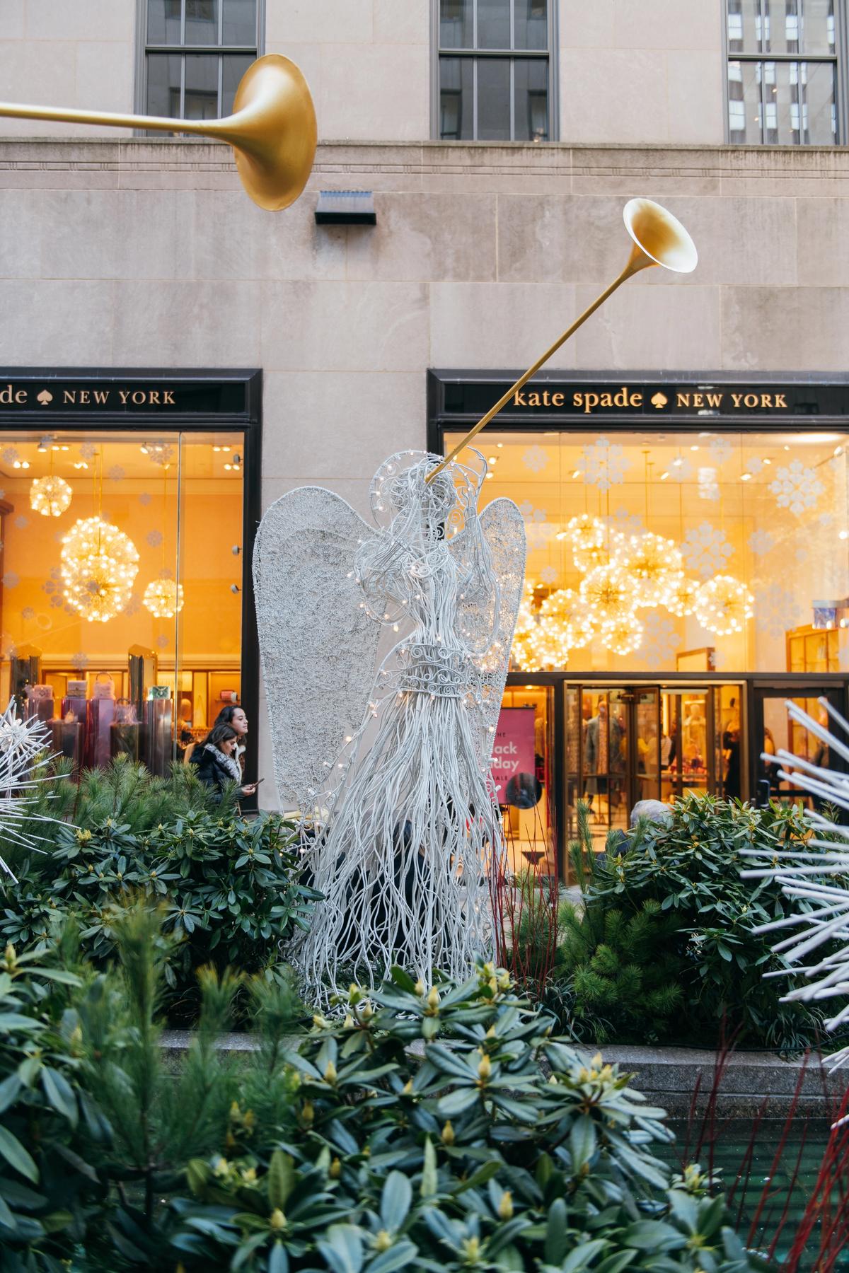 Channel Gardens angel in front of the Kate Spade store at Rockefeller Center